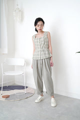 Green checked vest in peplum hem