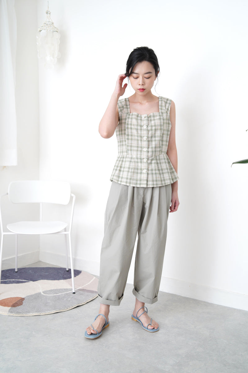 Green checked vest in peplum hem