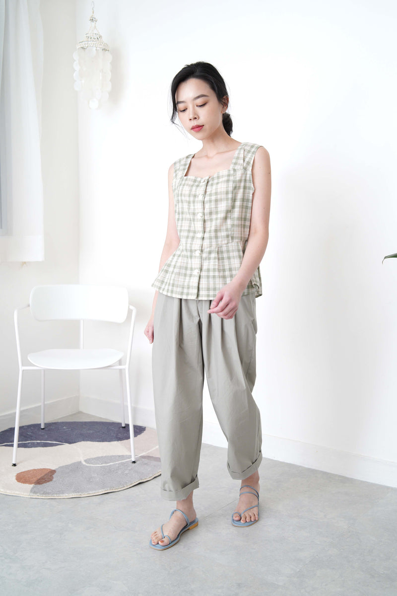 Green checked vest in peplum hem