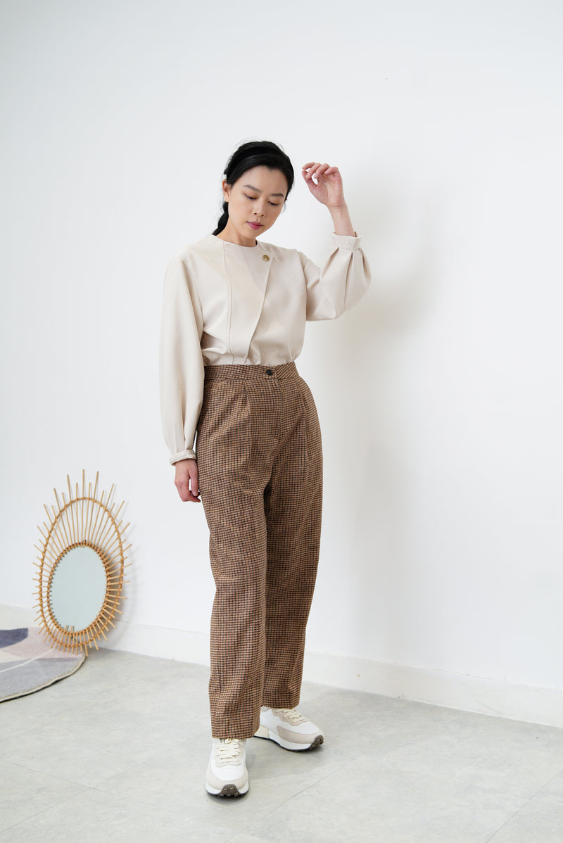 Nude satin blouse in asymmetrical cutting