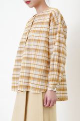 Yellow checked blouse in round hem