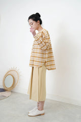 Yellow checked blouse in round hem