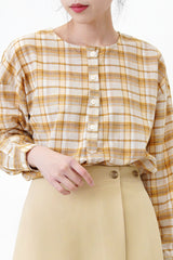 Yellow checked blouse in round hem