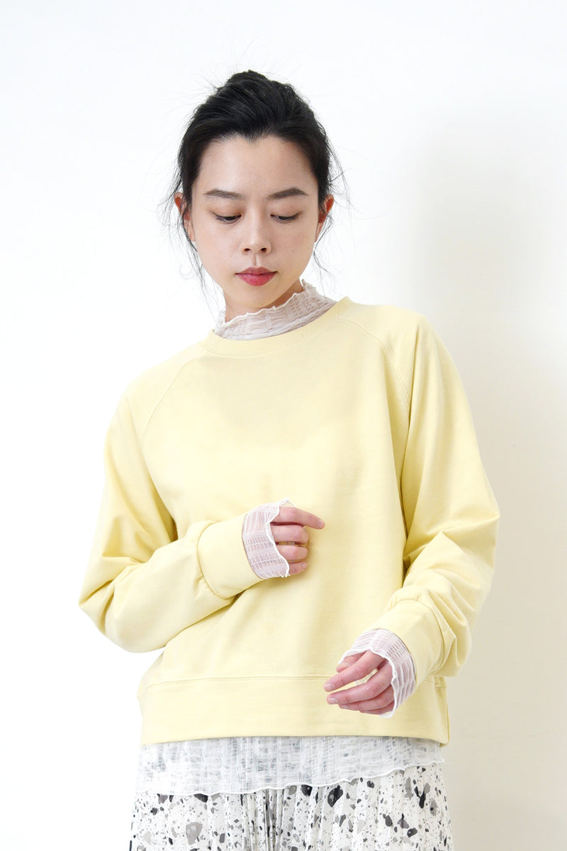 Pastel yellow pullover in crop cut