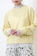 Pastel yellow pullover in crop cut