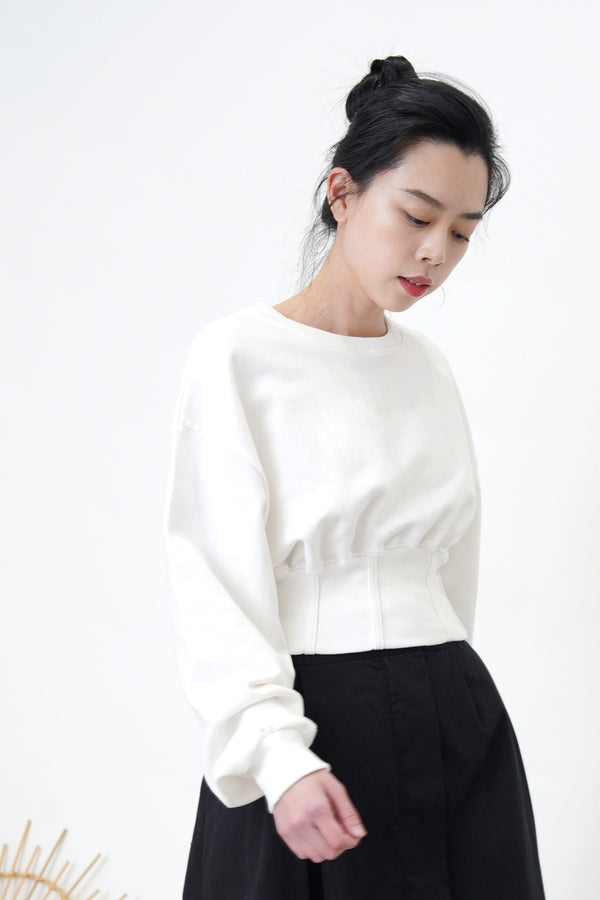 White pullover in corset hem