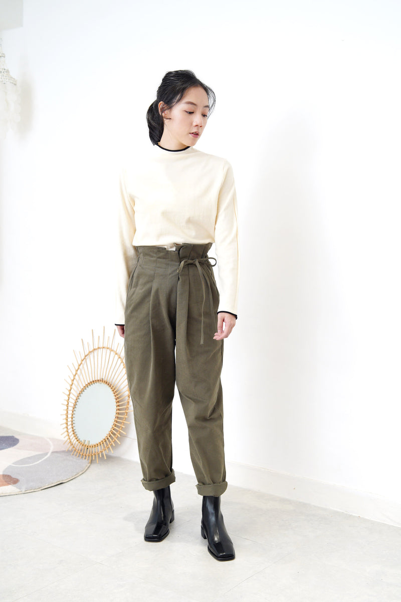 Cream funnel neck top in contrast trimmed