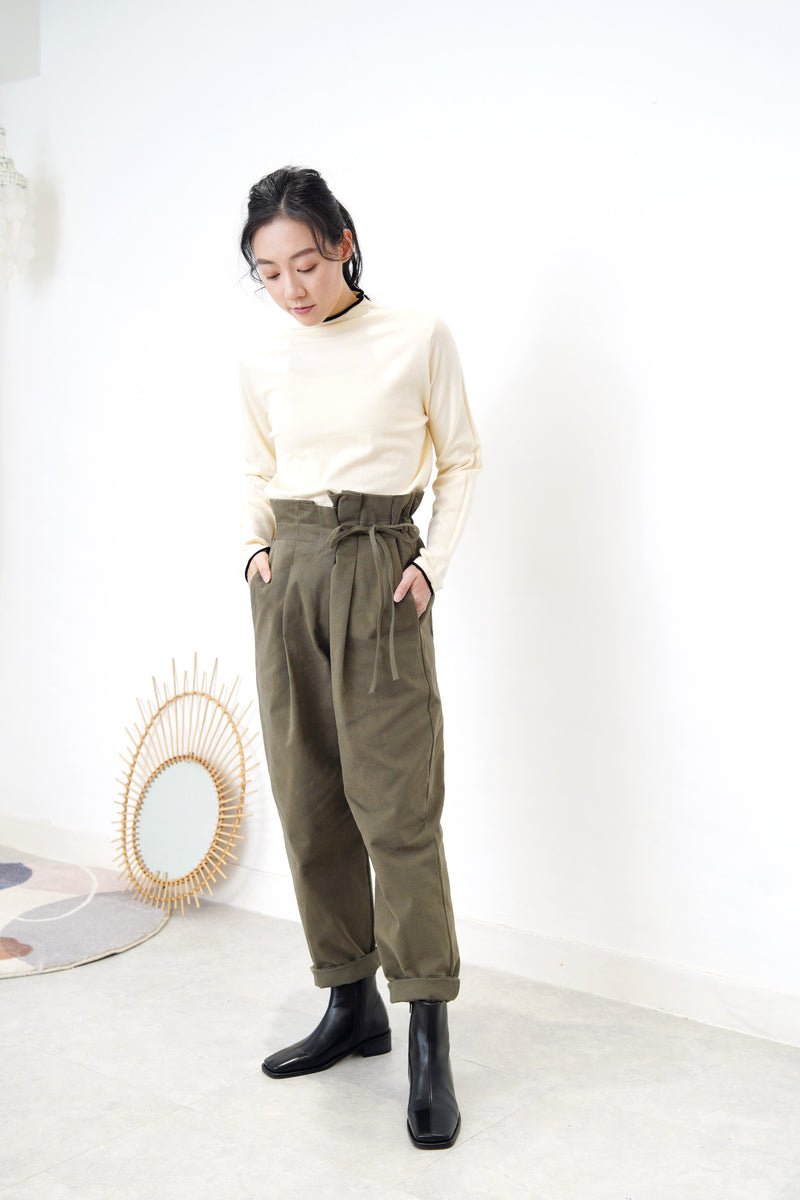 Cream funnel neck top in contrast trimmed