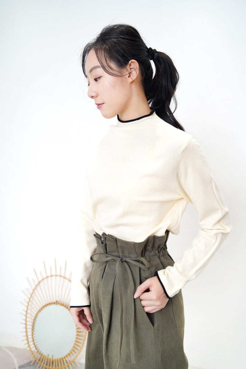 Cream funnel neck top in contrast trimmed