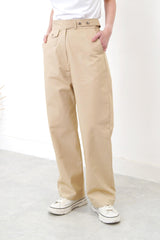 Beige trousers in detail waist strap
