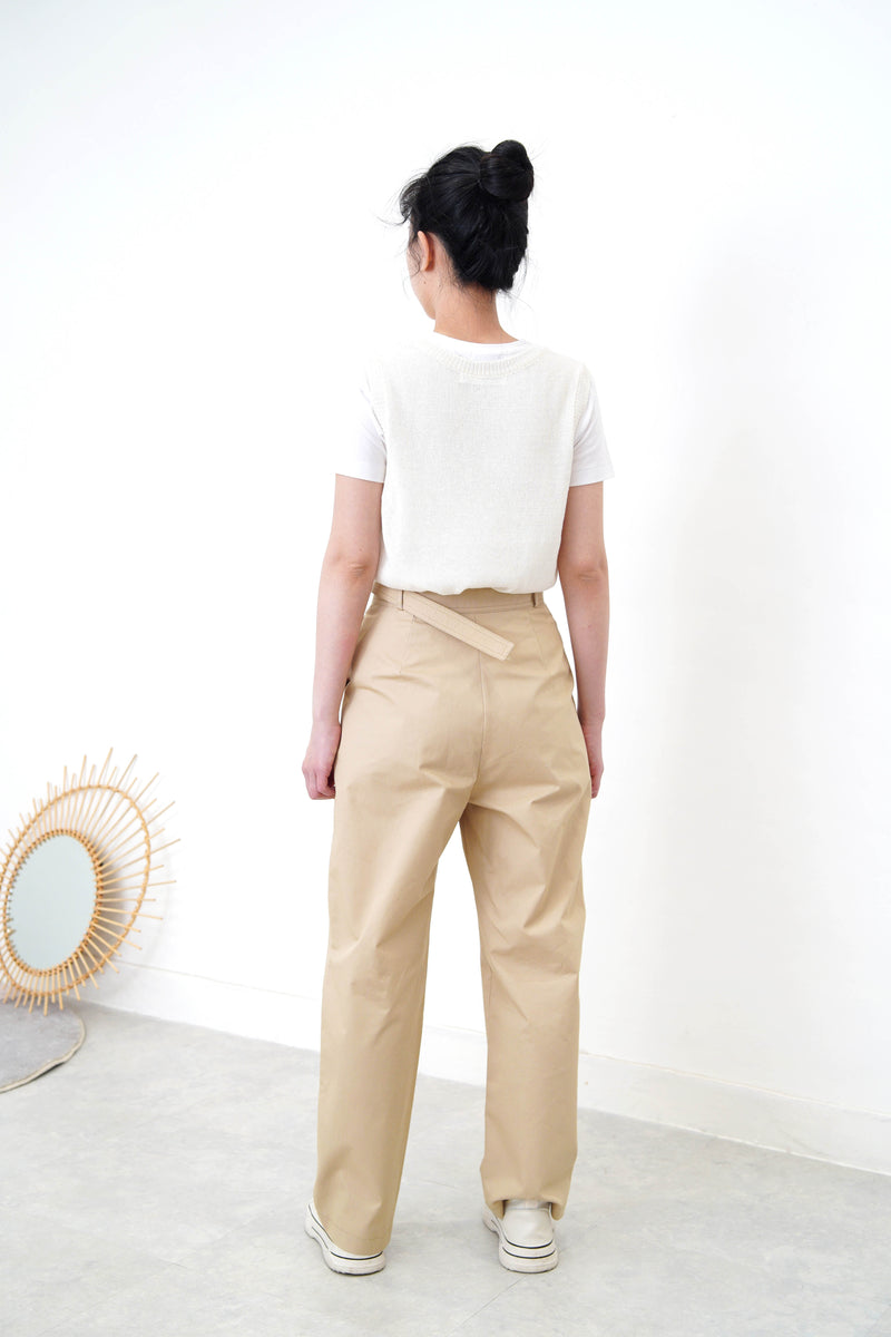 Beige trousers in detail waist strap