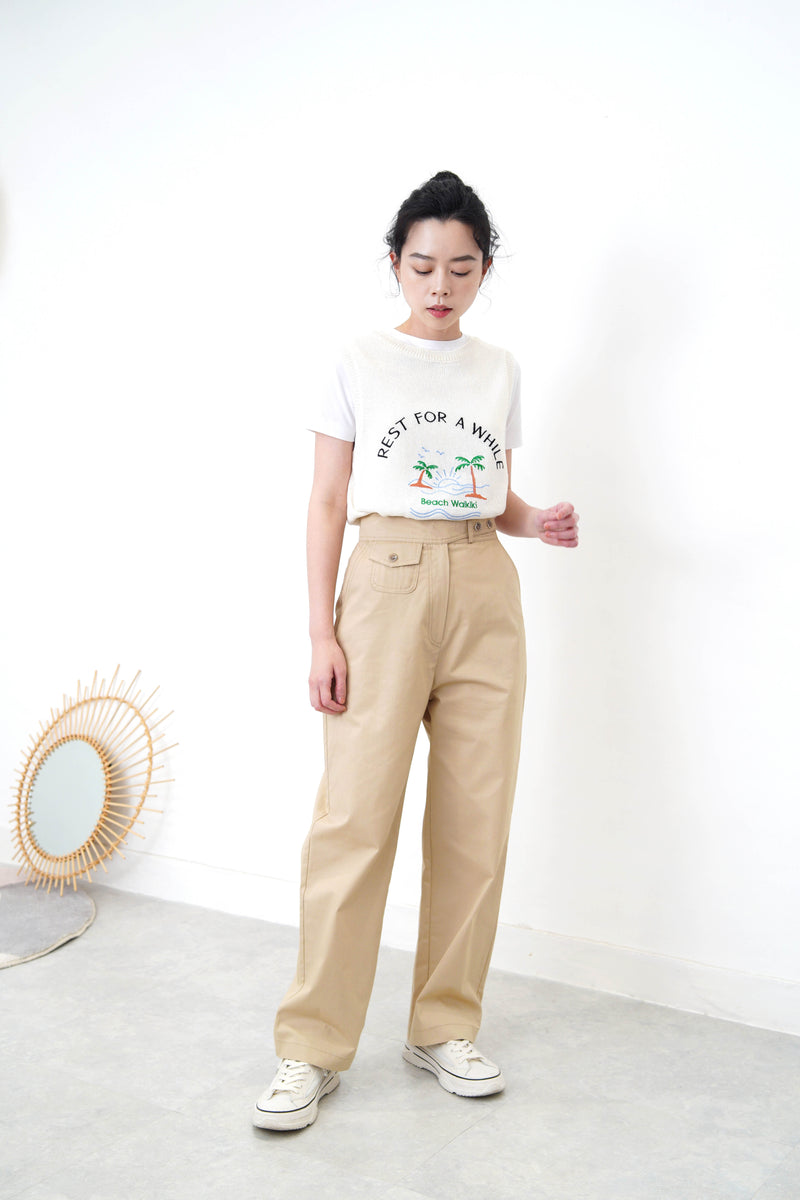 Beige trousers in detail waist strap