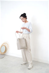 Grey leather tote in round thin strap