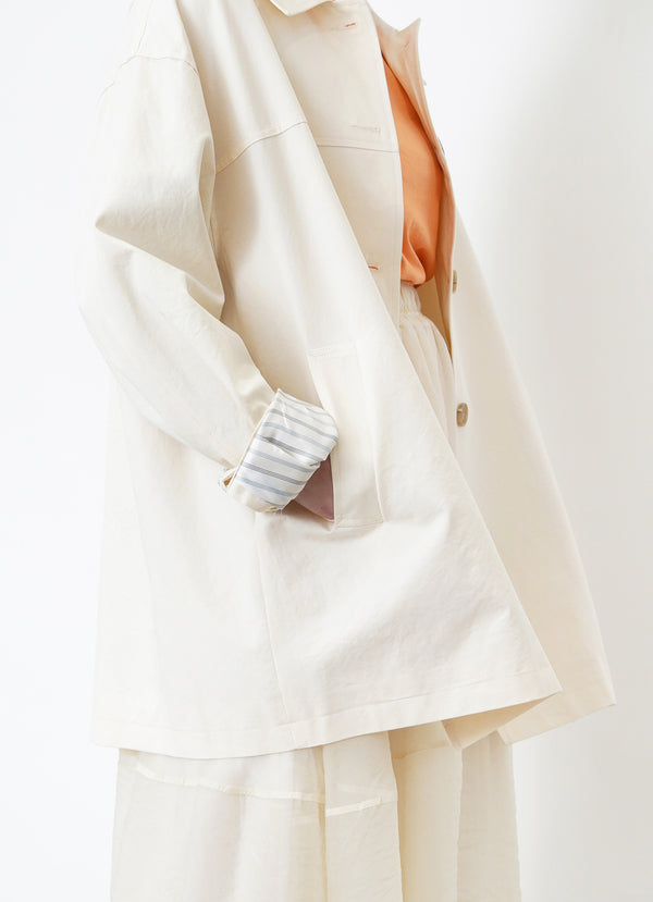 Cream trench coat w/ contrast sleeves