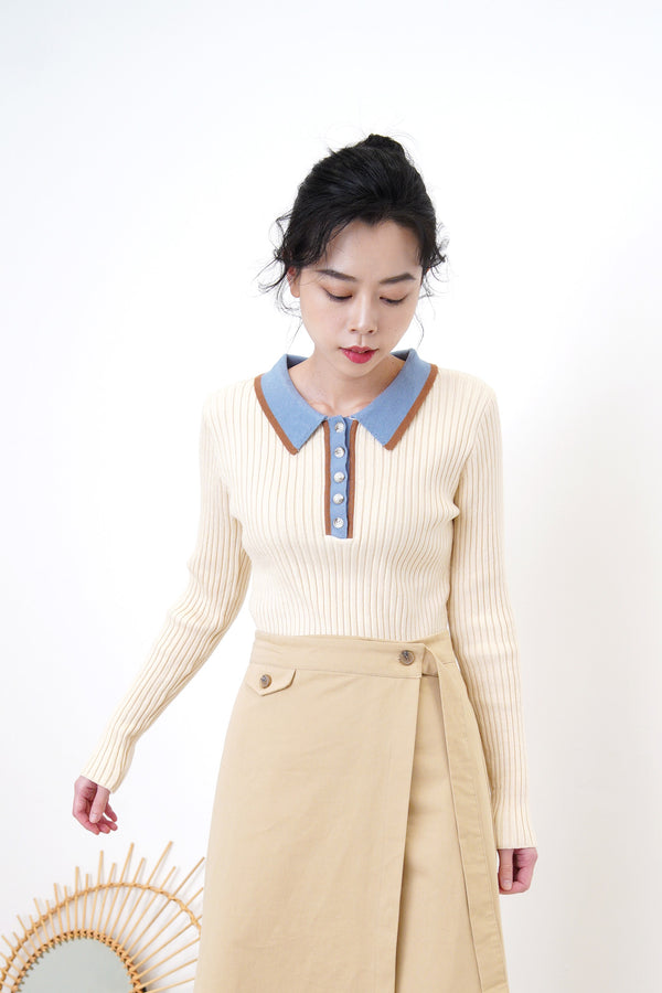 Light beige knit top w/ blue polo collar