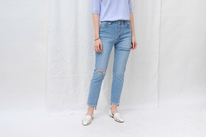 Blue high waist jeans in ripped details