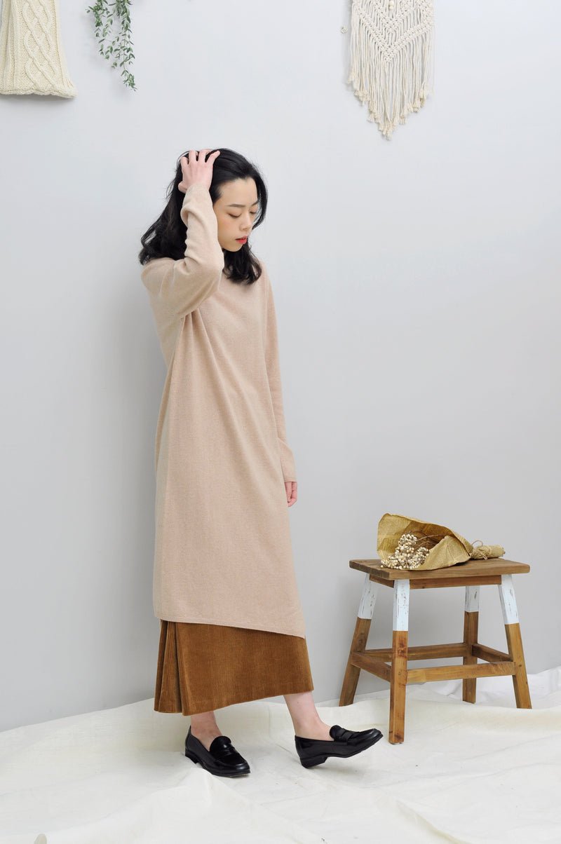 Beige knit dress in asymmetric hem