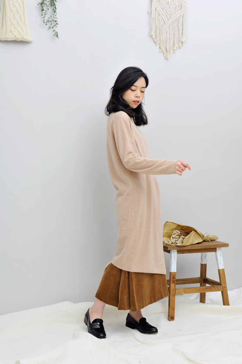 Beige knit dress in asymmetric hem